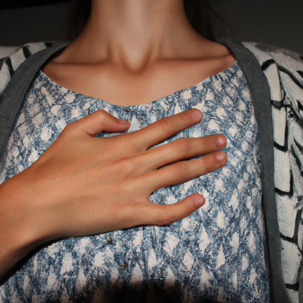Person holding their chest in pain