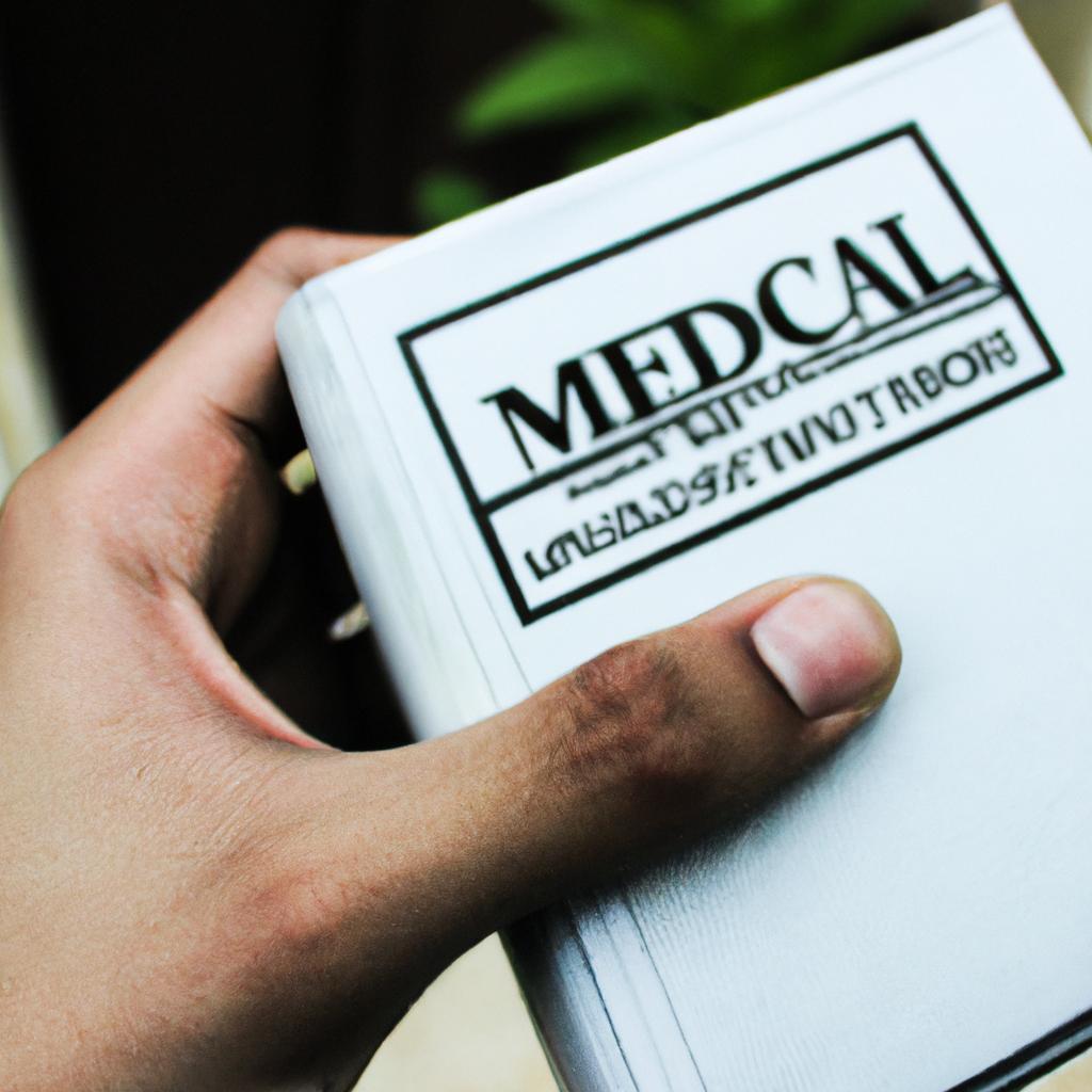 Person holding a medical pamphlet